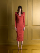 We’re Not Us Dress in vibrant orange, featuring a stylish design suitable for various occasions.