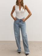  Soft and stretchy white bodysuit, showcasing a sleek and comfortable design for versatile wear.