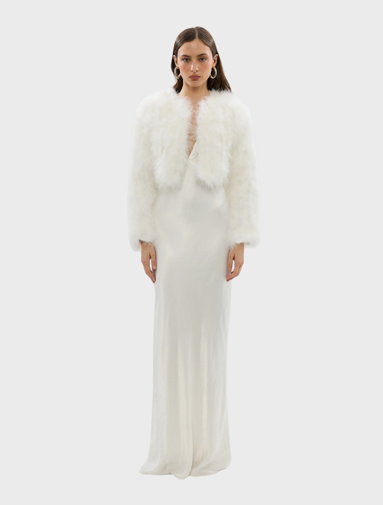 Luxurious white crop jacket with marabou feathers, structured shoulders, and hook-and-eye closure for a stylish evening look.
