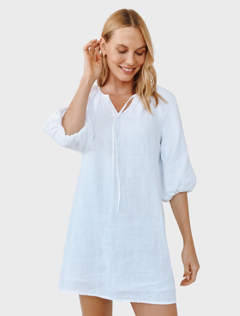 Elegant white pullover dress with puff sleeves, perfect for casual or semi-formal occasions.