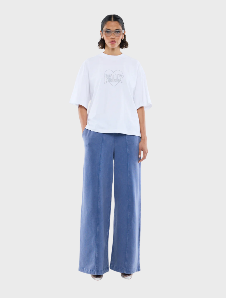 A white t-shirt adorned with a shimmering rhinestone logo at the center.