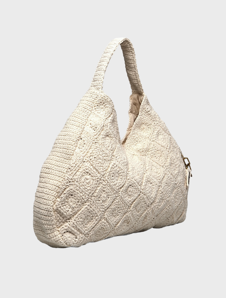 A sleek white bag with an innovative design, combining elegance and utility for everyday use.