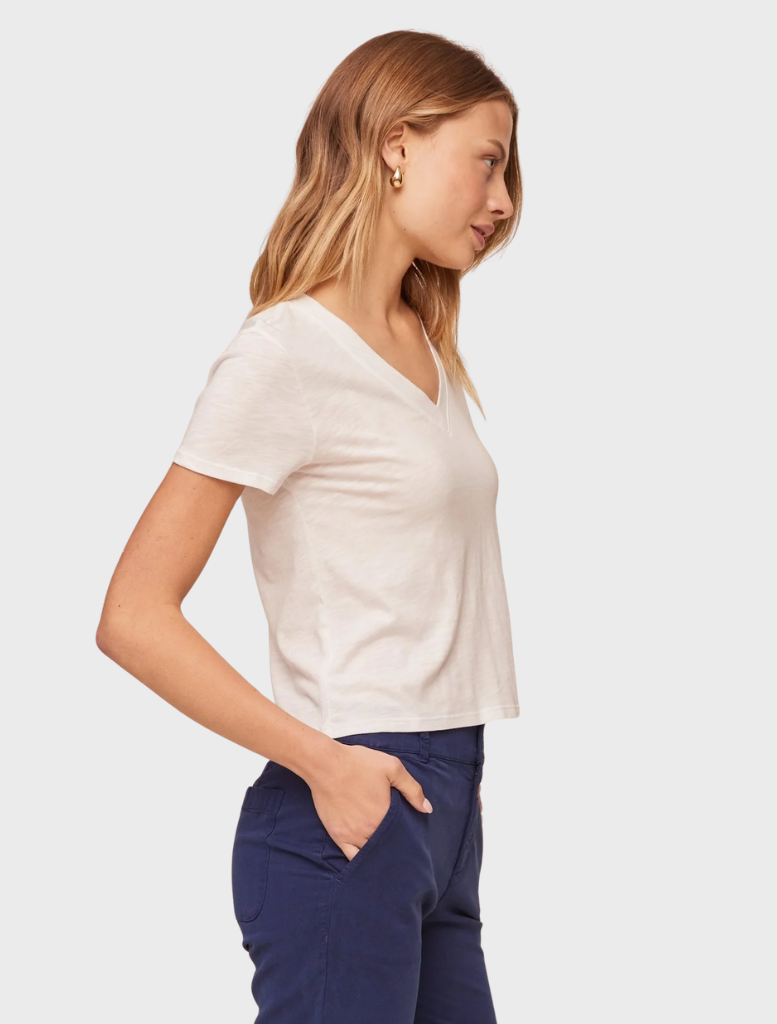 A white V-neck t-shirt laid flat, highlighting its soft fabric and casual style.