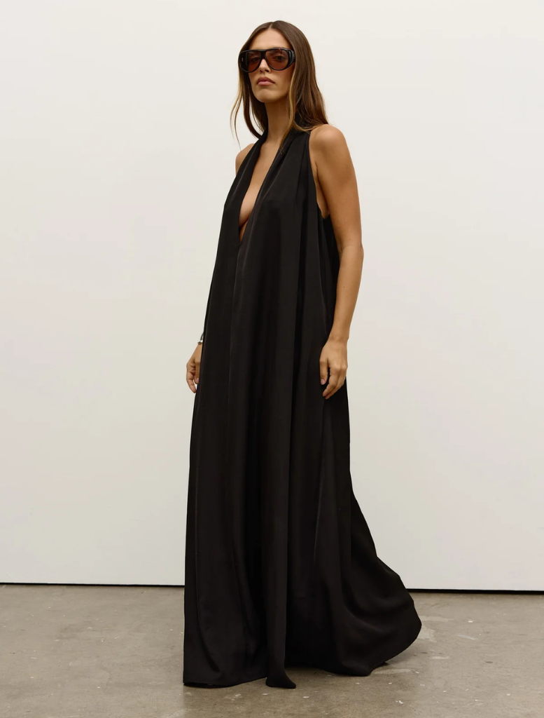 Black Willow dress draped elegantly, highlighting its chic design and versatile style for different occasions.