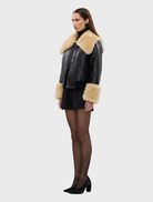 Versatile black Willow Jacket featuring down filling, shearling details, and an oversized collar for a chic, relaxed fit.