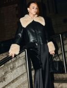 Black Willow Jacket with leather-look finish, shearling accents, oversized collar, and relaxed fit for versatile layering.