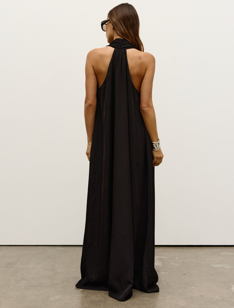 A black Willow dress on display, featuring a sophisticated cut and fabric ideal for both day and evening wear.