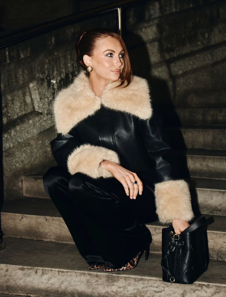Versatile black Willow Jacket featuring down filling, shearling details, and an oversized collar for a chic, relaxed fit.