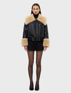 Elegant black Willow Jacket designed with shearling accents, oversized collar, and relaxed fit for casual or polished looks.