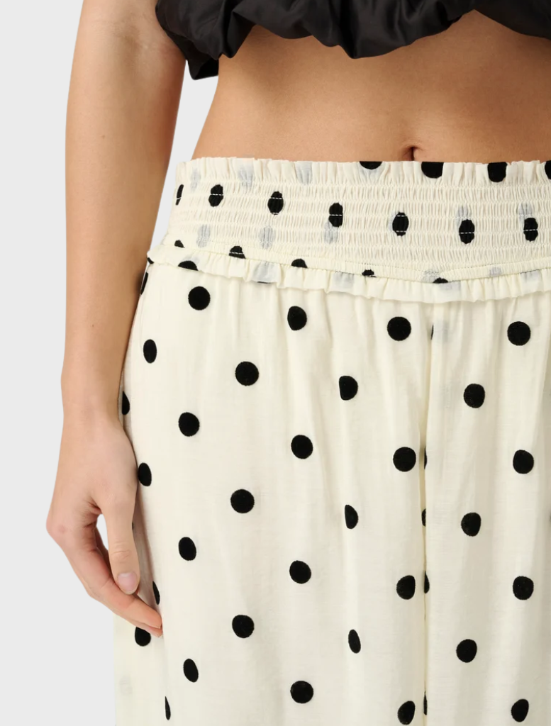Heirloom Dot Willow Pant combines relaxed tailoring with a balloon silhouette, tapering at the ankle for a contemporary appearance.