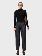 Stylish black Windsor knit top, designed for comfort and versatility in both casual and professional environments.