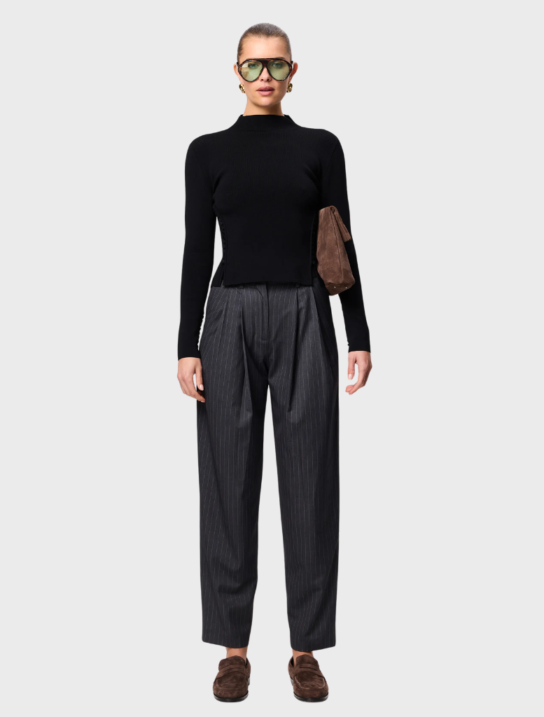 Stylish black Windsor knit top, designed for comfort and versatility in both casual and professional environments.