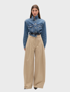 Ash Tide Winslow Denim Jacket, showcasing a timeless cut with a soft blue hue and functional front pockets.