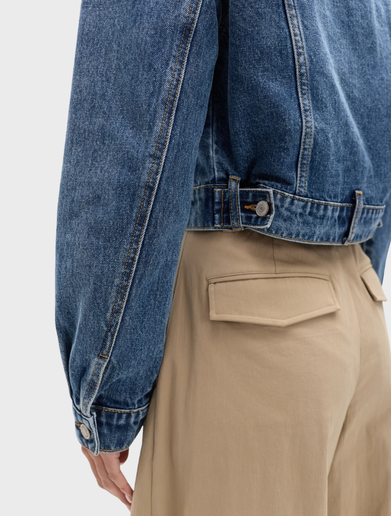 Ash Tide Winslow Denim Jacket, highlighting a classic denim silhouette with a soft blue color and practical pockets.