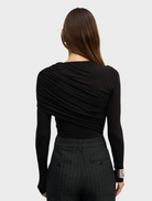 Shadow Ariya bodysuit, characterized by its streamlined shape and versatile style for everyday wear.