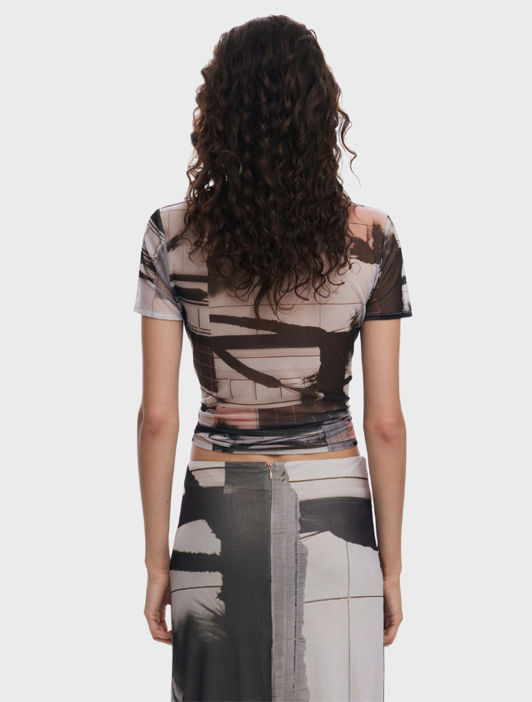 A creatively designed T-shirt featuring an artistic print, ideal for adding flair to everyday outfits.