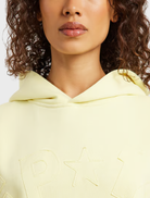 Celestial yellow hoodie featuring an oversized fit, brushed fleece fabric, and ribbed details, ideal for casual wear.