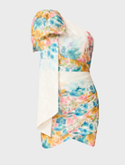 Stylish clementina one-shoulder mini dress with a multi floral print, emphasizing its chic design and vibrant colors.