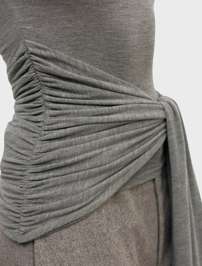 Light grey marle Isley top shown on a hanger, emphasizing its soft texture and relaxed fit for casual outfits.