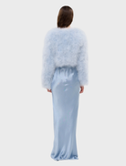 Stylish powder blue crop jacket featuring marabou feathers, structured shoulders, and a chic design for evening wear.