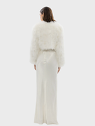 White crop jacket crafted from marabou feathers, featuring a structured shoulder design and satin finish lining for elegance.