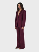 Stylish maroon collarless blazer from Maxine, perfect for adding a touch of sophistication to any outfit.