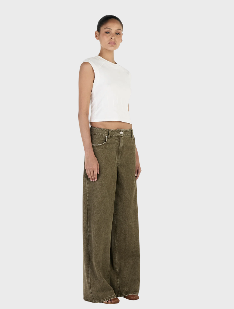 Close-up of khaki Paige Denim jeans, highlighting the stitching, pockets, and fabric quality, set against a plain background.