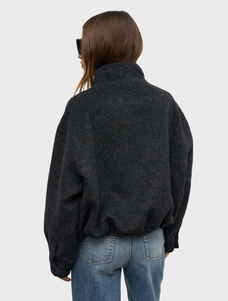 Deep ocean Preslie Bomber jacket presented on a hanger, emphasizing its contemporary style and rich color.