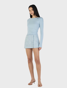Quinn's ice blue long sleeve top, crafted for a relaxed fit, ideal for casual outings or as a layering piece.