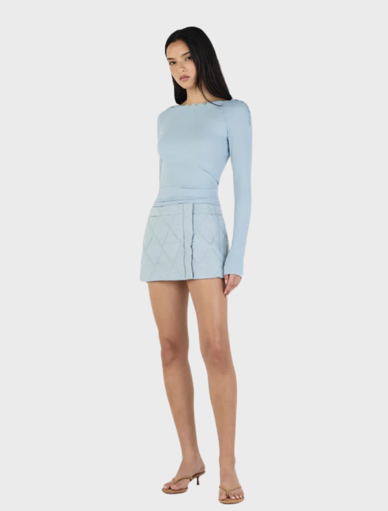 Quinn's ice blue long sleeve top, crafted for a relaxed fit, ideal for casual outings or as a layering piece.