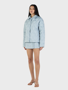 Quinton's ice blue quilted jacket, offering a modern look with cozy insulation for colder climates.