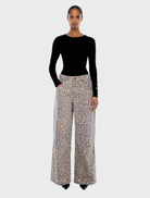 Leopard print Wynn Animal Jean displayed on a white background, showcasing its unique pattern and stylish design.