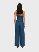 Chic bluestone denim bustier with a form-fitting design, perfect for enhancing any wardrobe with a trendy look.