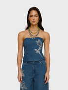 Bluestone denim bustier featuring a fitted design and structured silhouette, ideal for stylish layering or standalone wear.