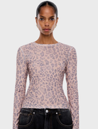 Long sleeve leopard print top featuring a stylish design suitable for casual wear.