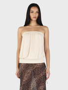 Zoe top in cream color, featuring a stylish design suitable for casual or formal occasions.