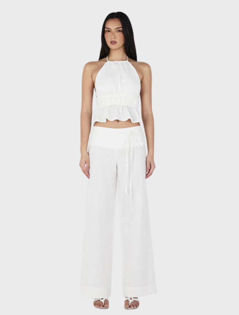 Zuri Halter Top in ivory, featuring a stylish design suitable for casual or formal occasions.